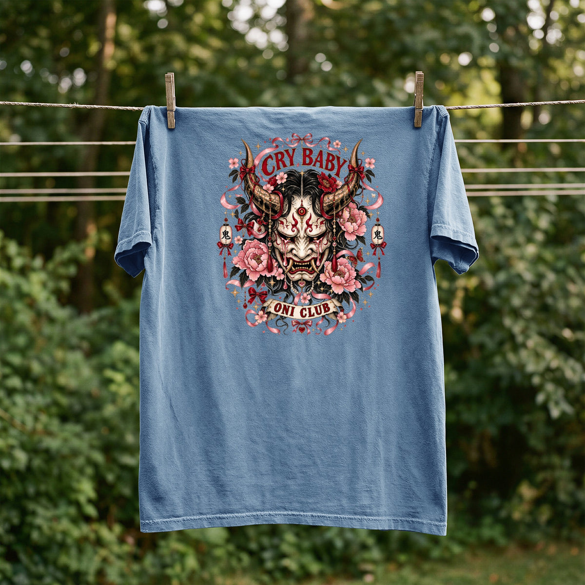 Blue t-shirt with "Cry Baby Oni Club" text and Japanese mask graphic.