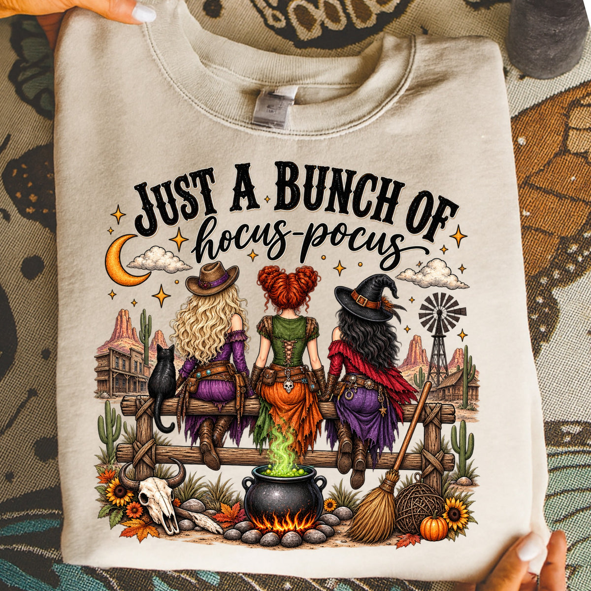 Three witches sit on a fence under a moon with "Just a bunch of hocus-pocus" text.