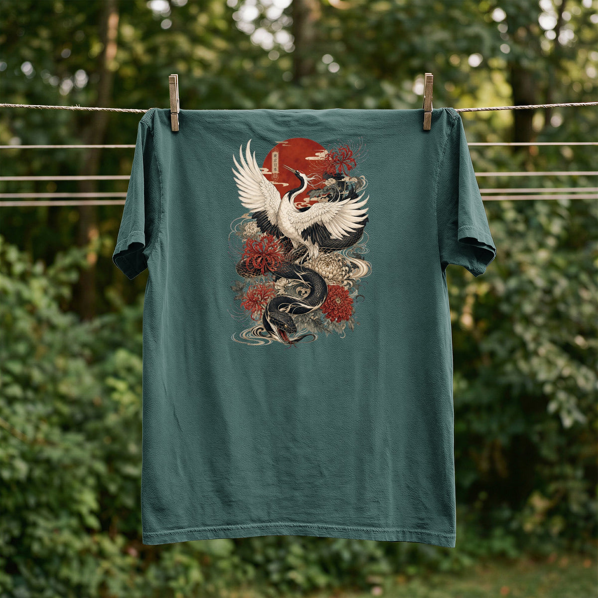 Teal t-shirt with Japanese dragon, crane, and sun graphic design.