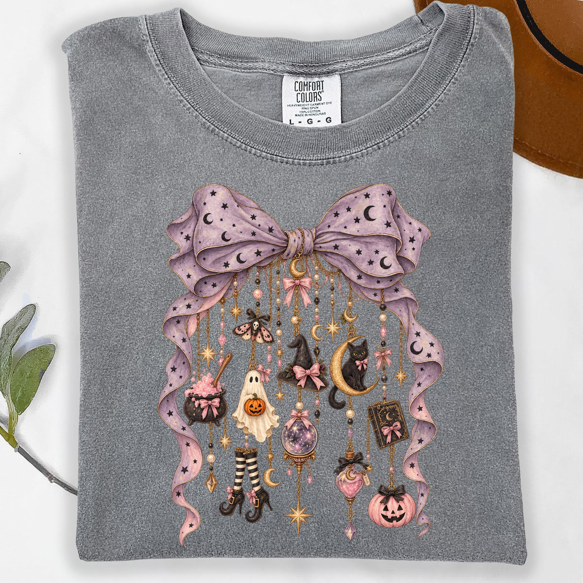 Gray t-shirt with purple ribbon bow and hanging Halloween icons.
