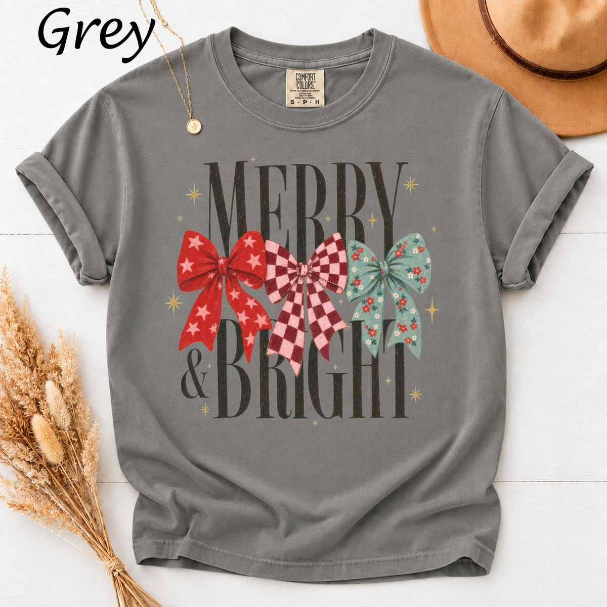 Grey t-shirt with "Merry & Bright" and three festive bows.