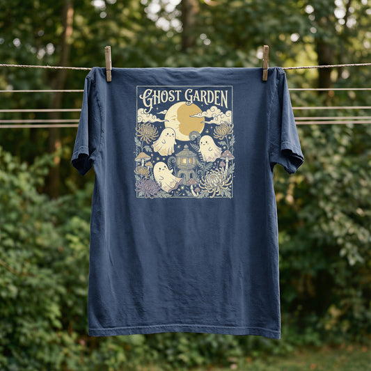 Navy t-shirt with "Ghost Garden" graphic featuring ghosts, moon, mushrooms, and flowers.