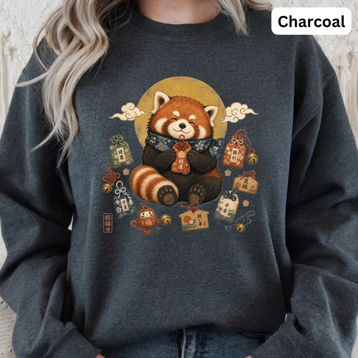 Charcoal sweatshirt with a red panda surrounded by Japanese good luck charms.