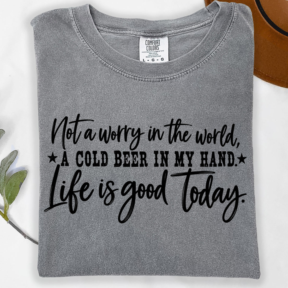 Gray t-shirt with text "Not a worry in the world, A cold beer in my hand. Life is good today."