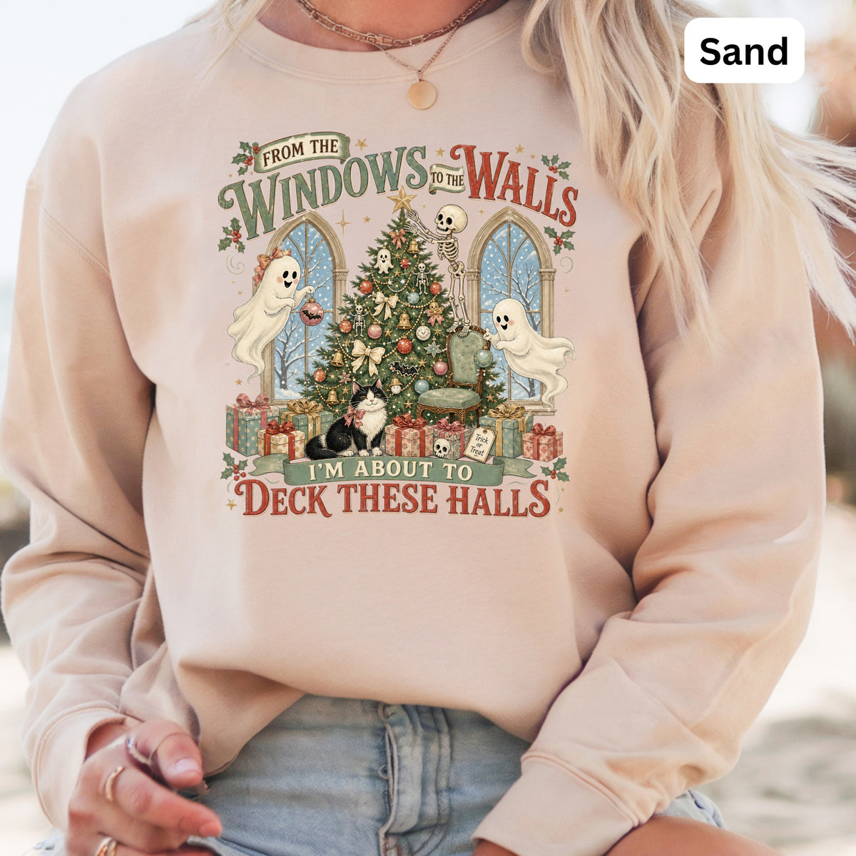 Crewneck sweatshirt with spooky Christmas graphic featuring ghosts, skeleton, cat, and text.