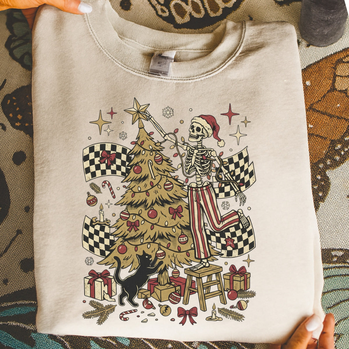Skeleton decorating a Christmas tree with a black cat, checkered flags, and gifts.