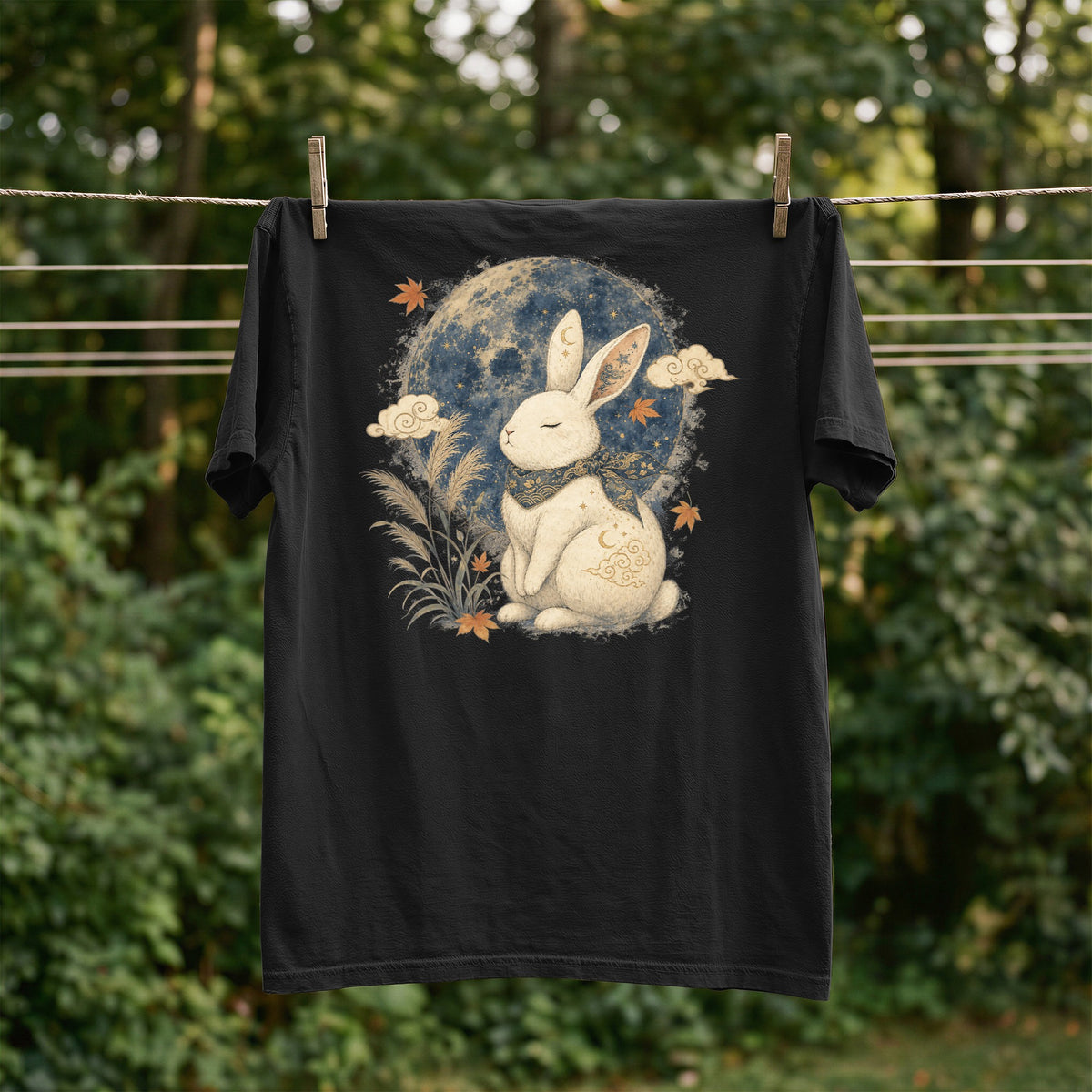 Black t-shirt with a white rabbit and moon design.