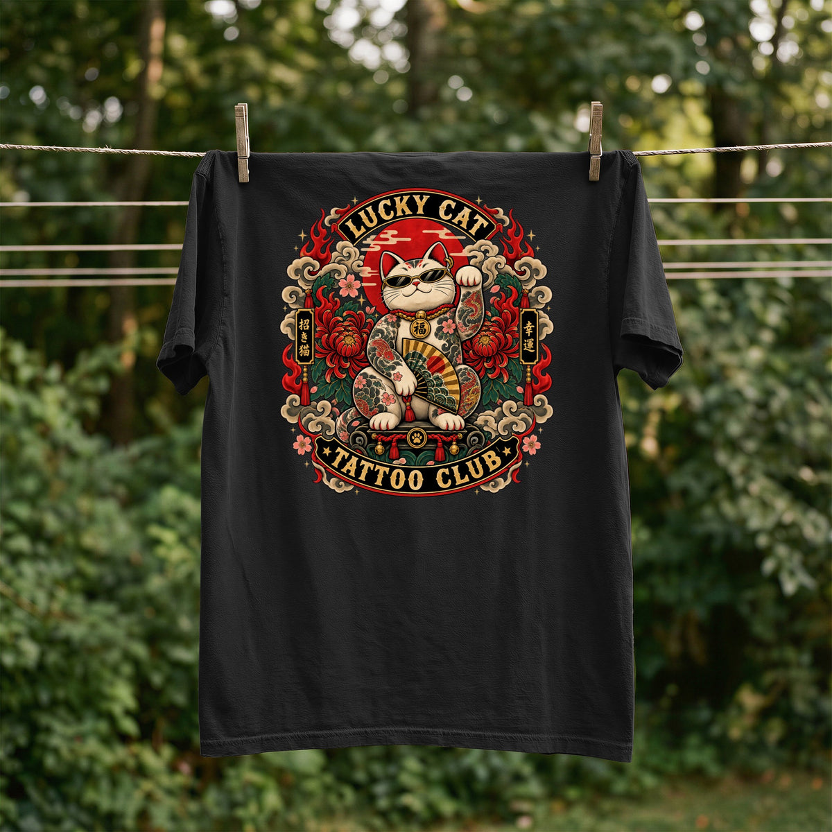 Black t-shirt with tattooed lucky cat graphic and "Lucky Cat Tattoo Club" text.