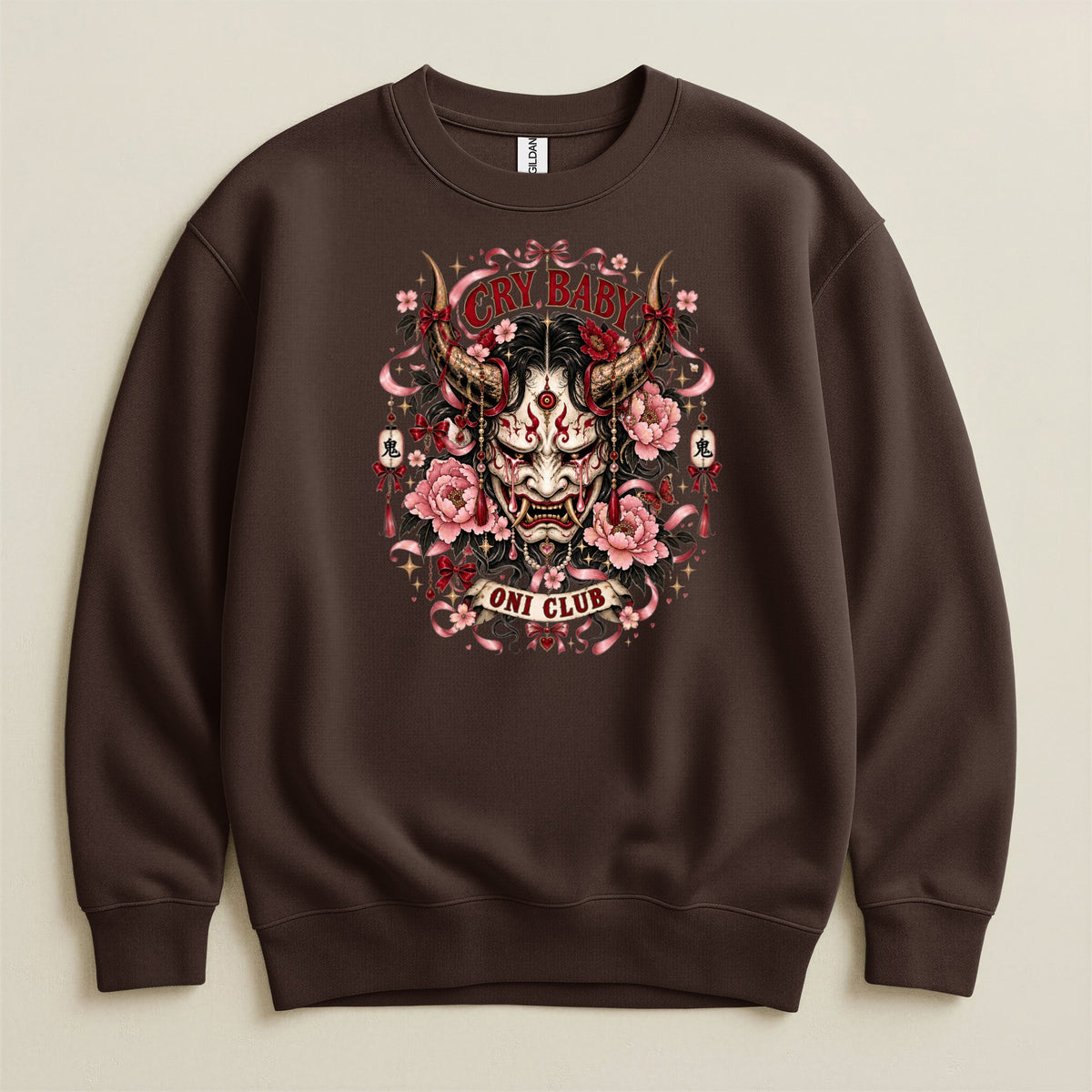 Brown sweatshirt with a "Cry Baby Oni Club" graphic featuring a demon mask and flowers.