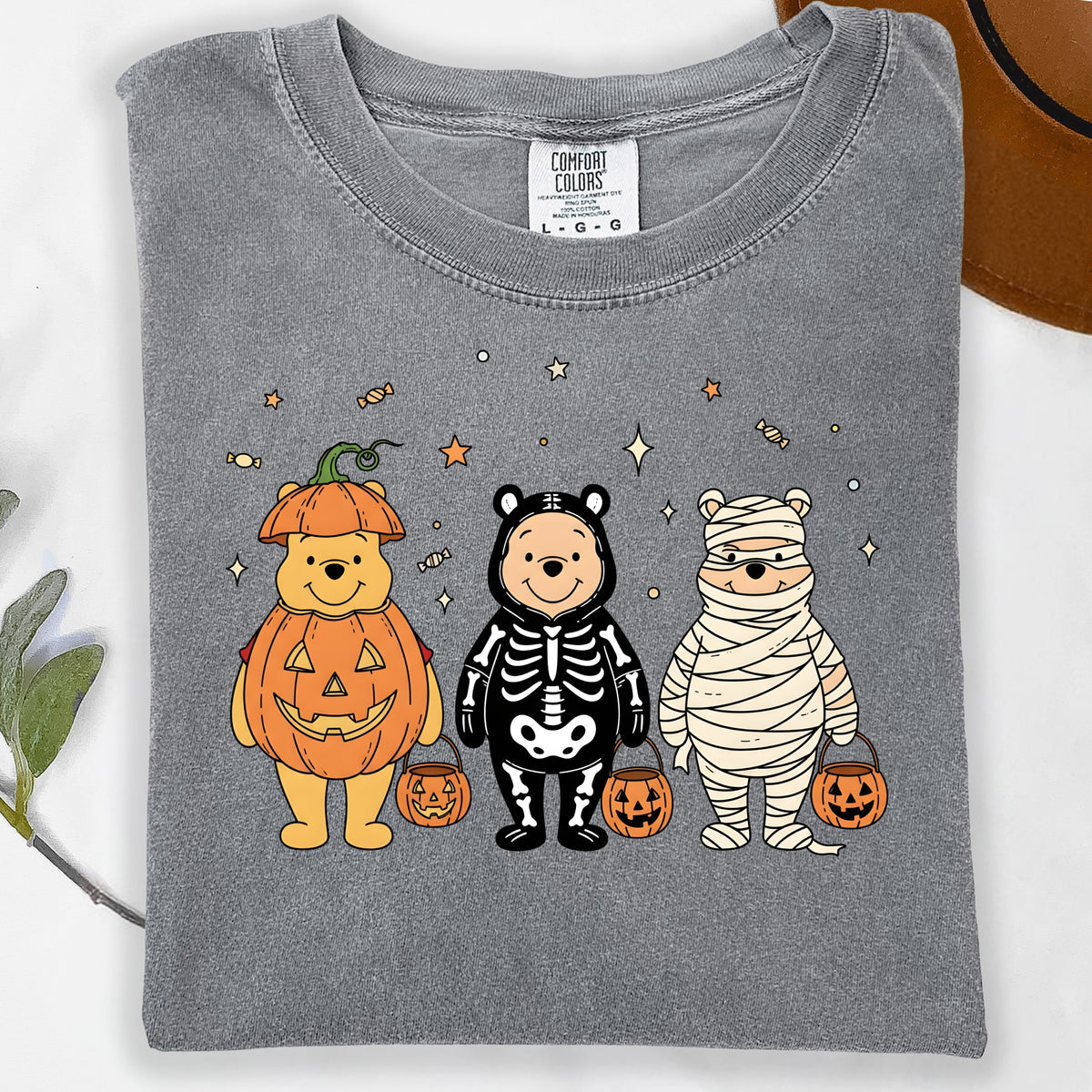 Gray t-shirt with Winnie the Pooh as a pumpkin, skeleton, and mummy.