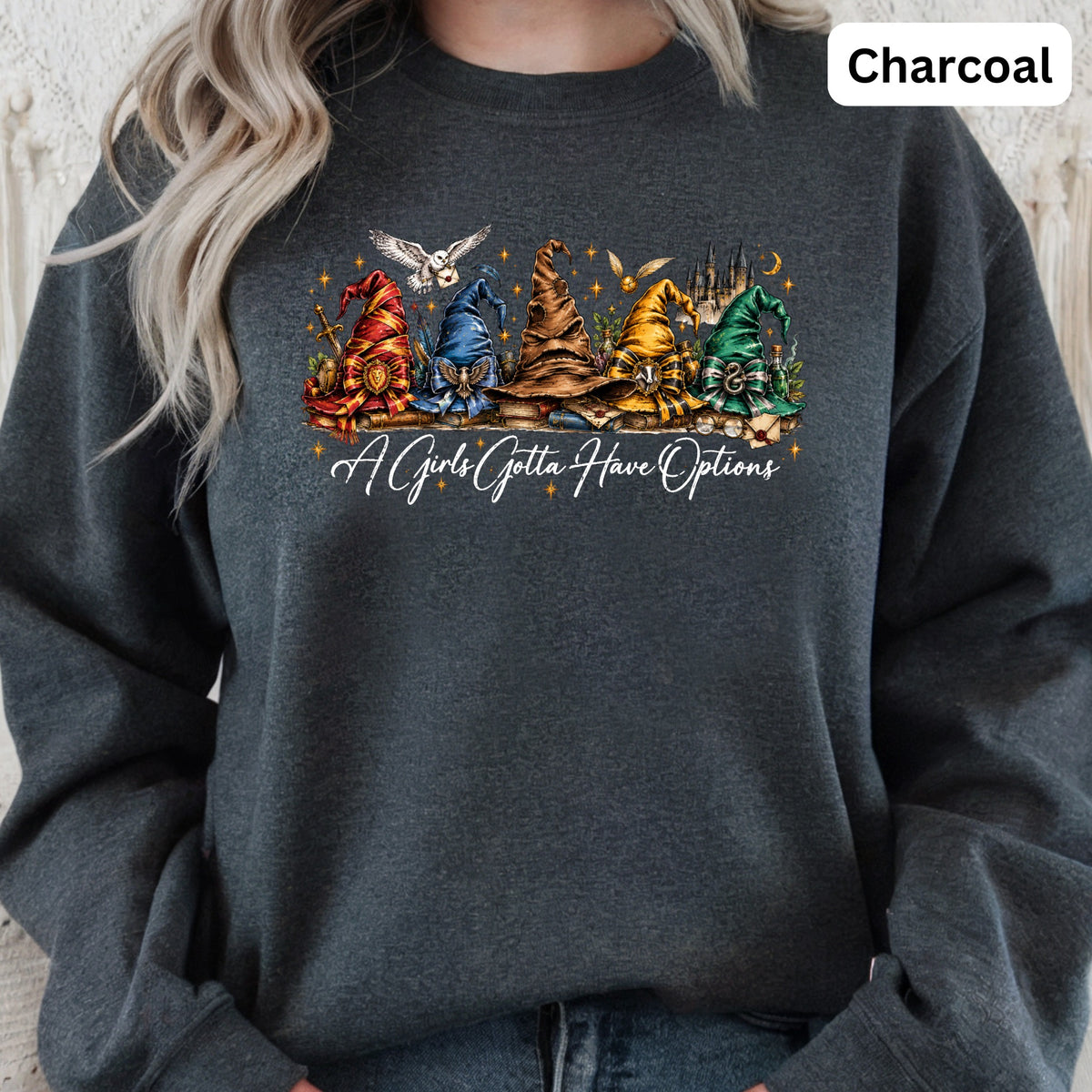 Charcoal sweatshirt with a graphic of sorting hats, an owl, and castle.