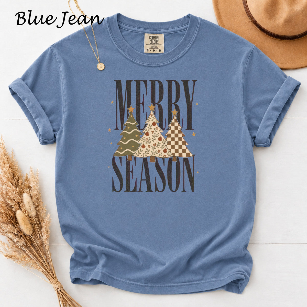 Blue Jean t-shirt with "Merry Season" and three decorated Christmas trees.