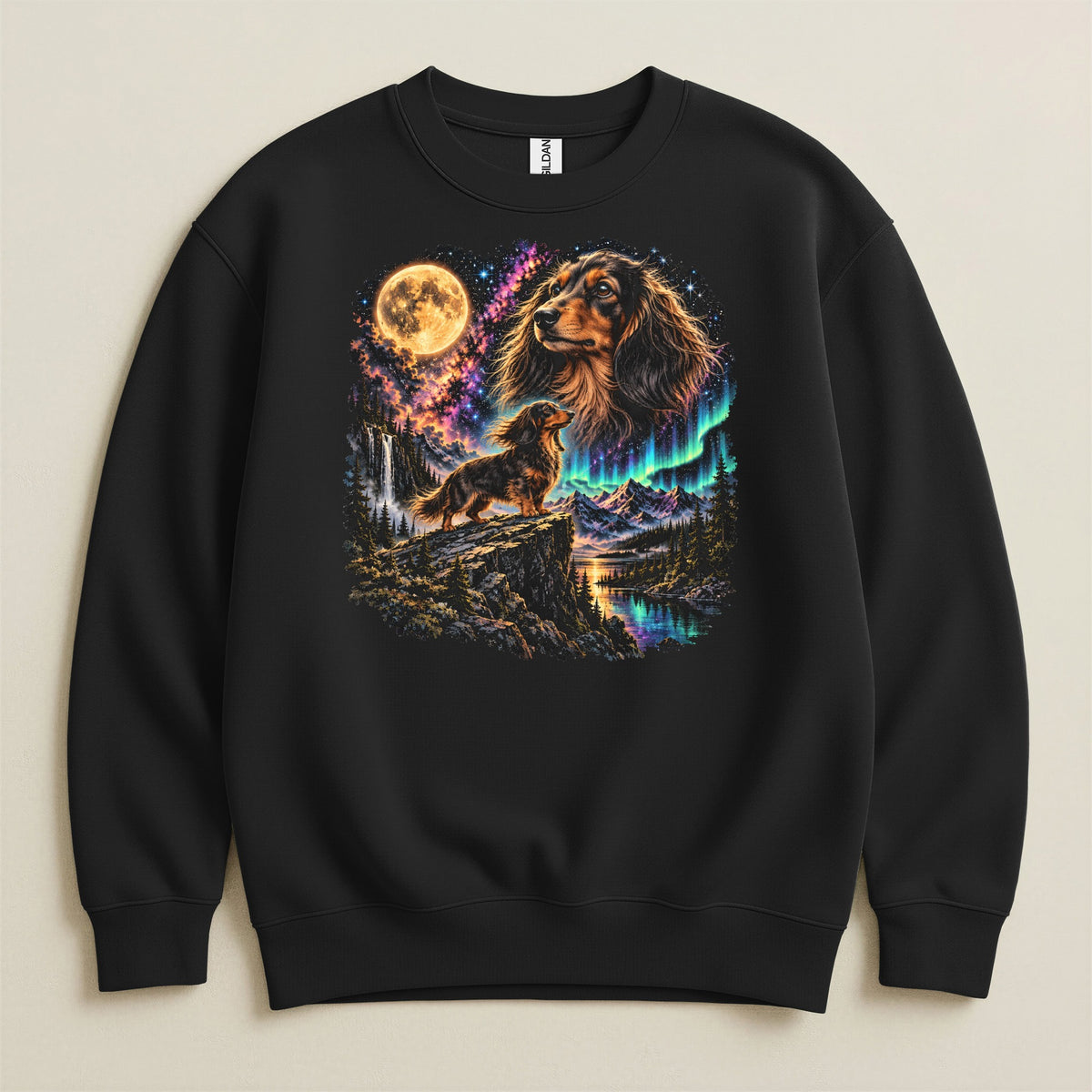 Black sweatshirt with a colorful graphic of a dachshund on a cliff under a full moon and aurora borealis.