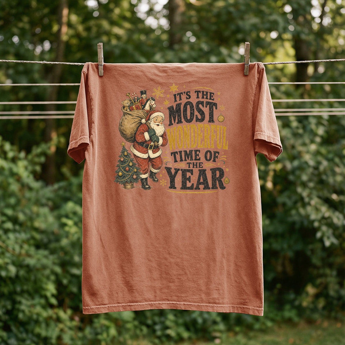 Coral t-shirt with Santa, Christmas tree, and "It's the Most Wonderful Time of the Year" text.
