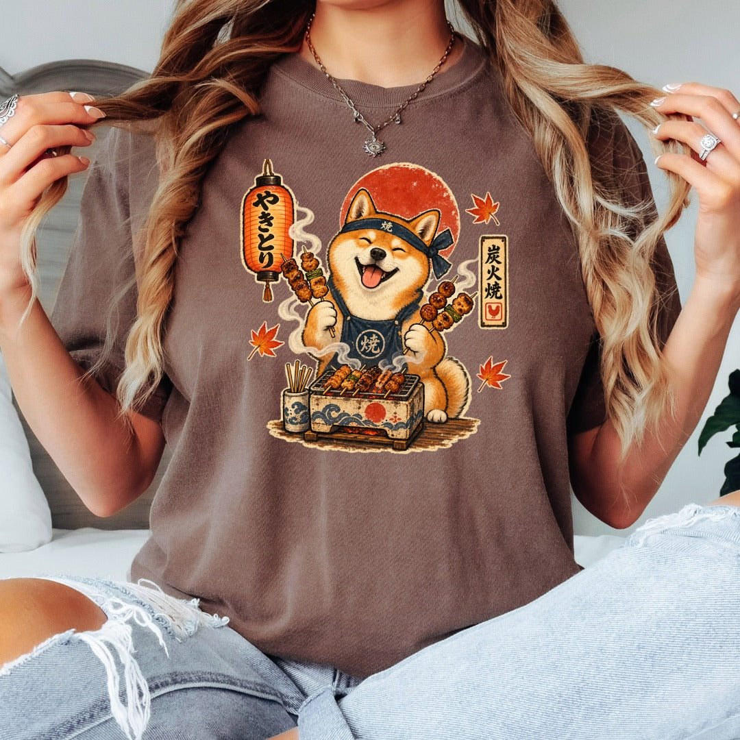 Shiba Inu grilling yakitori with Japanese text, red sun, and maple leaves.