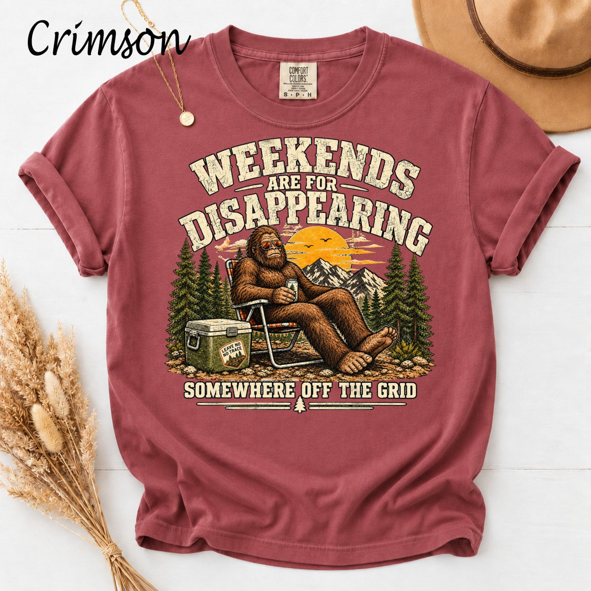 Bigfoot relaxing in a chair with text "Weekends are for Disappearing" and "Somewhere off the Grid."
