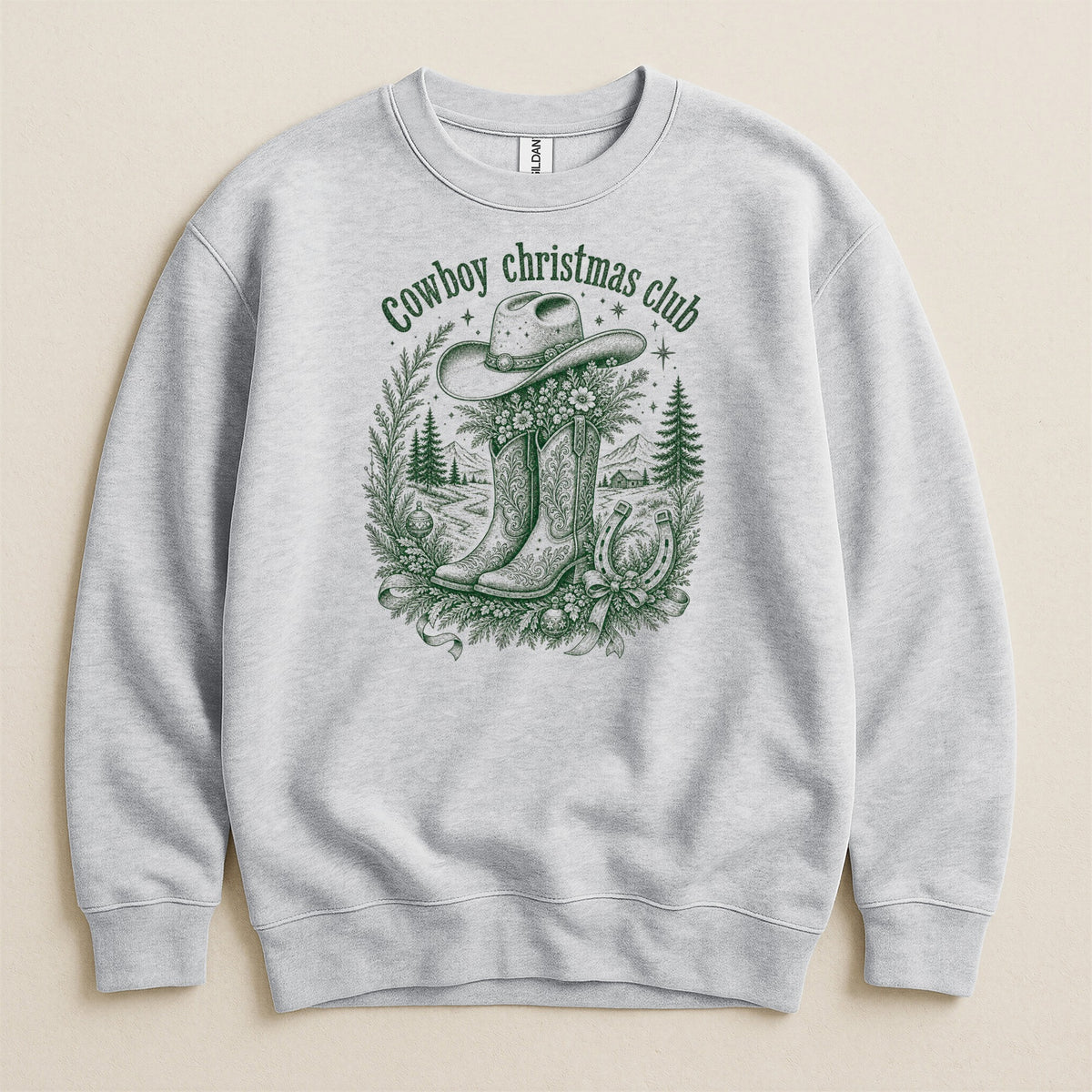 Light gray sweatshirt with green graphic of cowboy hat, boots, and holiday scene.